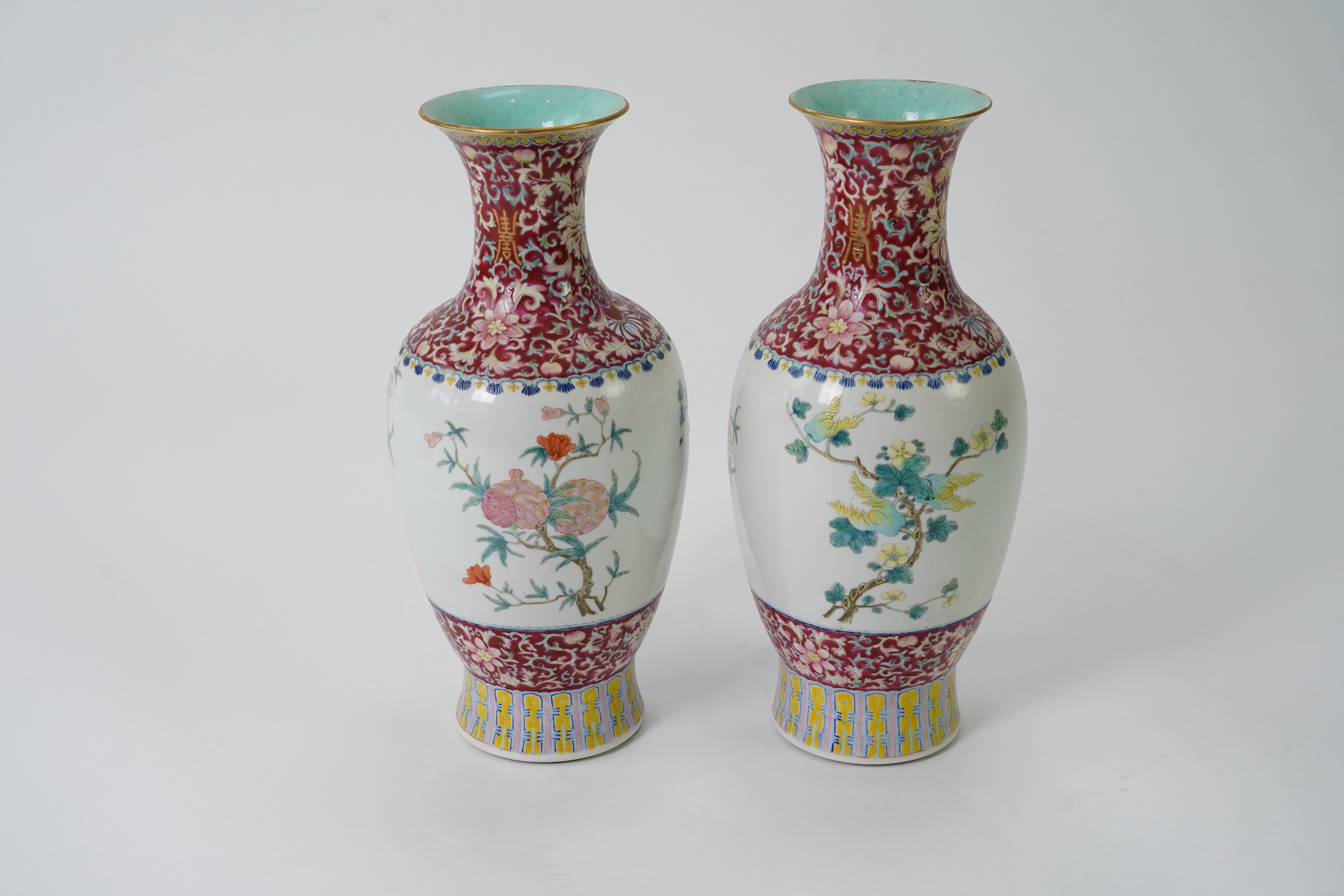 A pair of Chinese famille rose ‘sanduo’ vases, Qianlong seal mark, 19th century